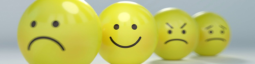yellow smileys with sad and happy faces